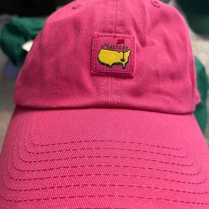 NWOT. Never worn. Masters ladies pink hat with newer masters emblem patch. Pink